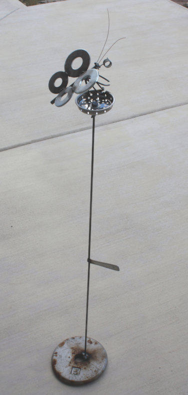 [Butterfly with flower, un ...]